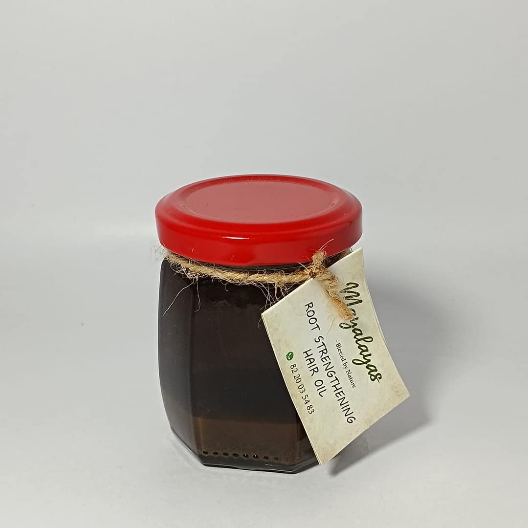Root strengthening hair oil with natural herbs